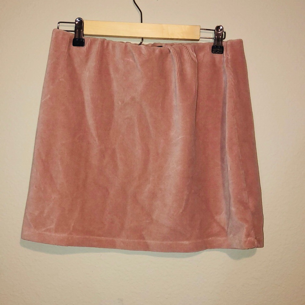 Short soft pink skirt.